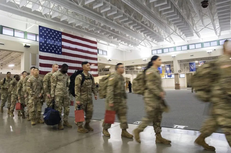 About 130 soldiers with the U.S. Army’s 87th Division Sustainment Support Battalion, 3rd Division Sustainment Brigade, wait to board a chartered plane during their deployment to Europe, March 11, 2022, at Hunter Army Airfield in Savannah, Georgia, US (AP)