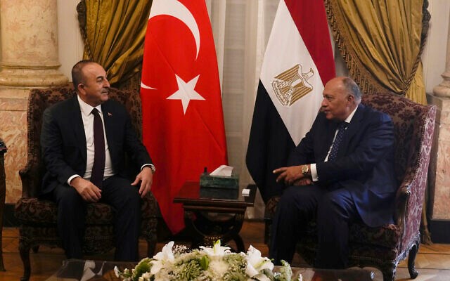 Egyptian Foreign Minister Sameh Shoukry, right, meets with his Turkish counterpart Mevlut Cavusoglu at Tahrir Palace in Cairo, Egypt, March 18, 2023. (AP)