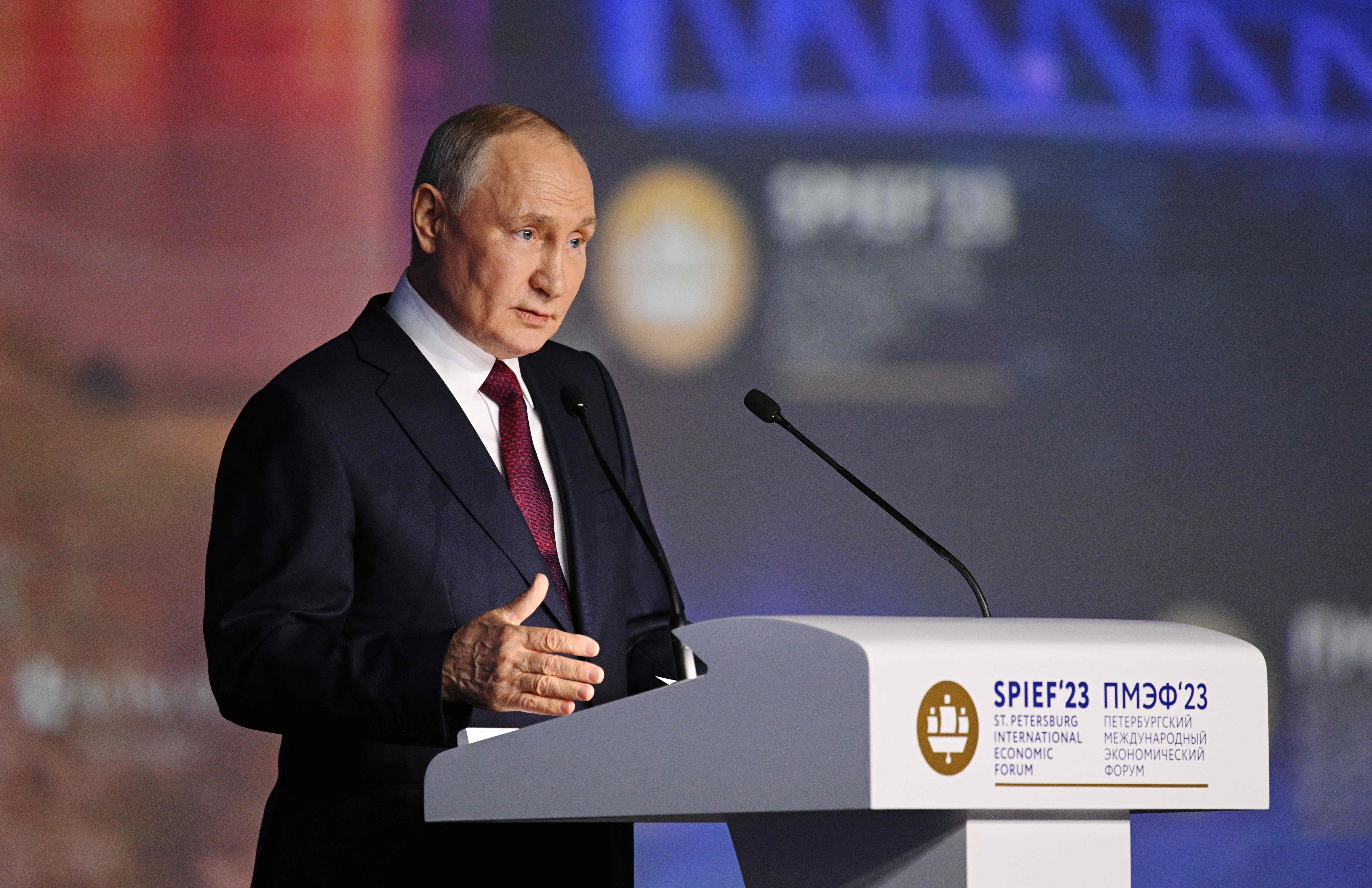 Russian President Vladimir Putin speaks at the St Petersburg International Economic Forum on Friday (AFP)