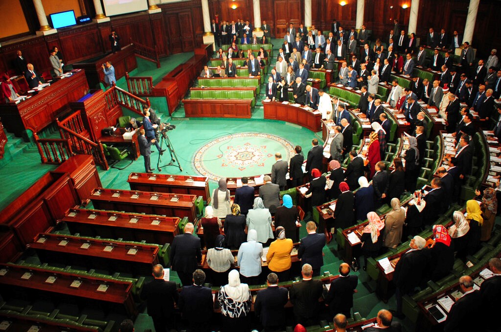 New Tunisian National Assembly parliement members stand during the first session of the chamber, Wednesday Nov.13, 2019 in Tunis. (AP)