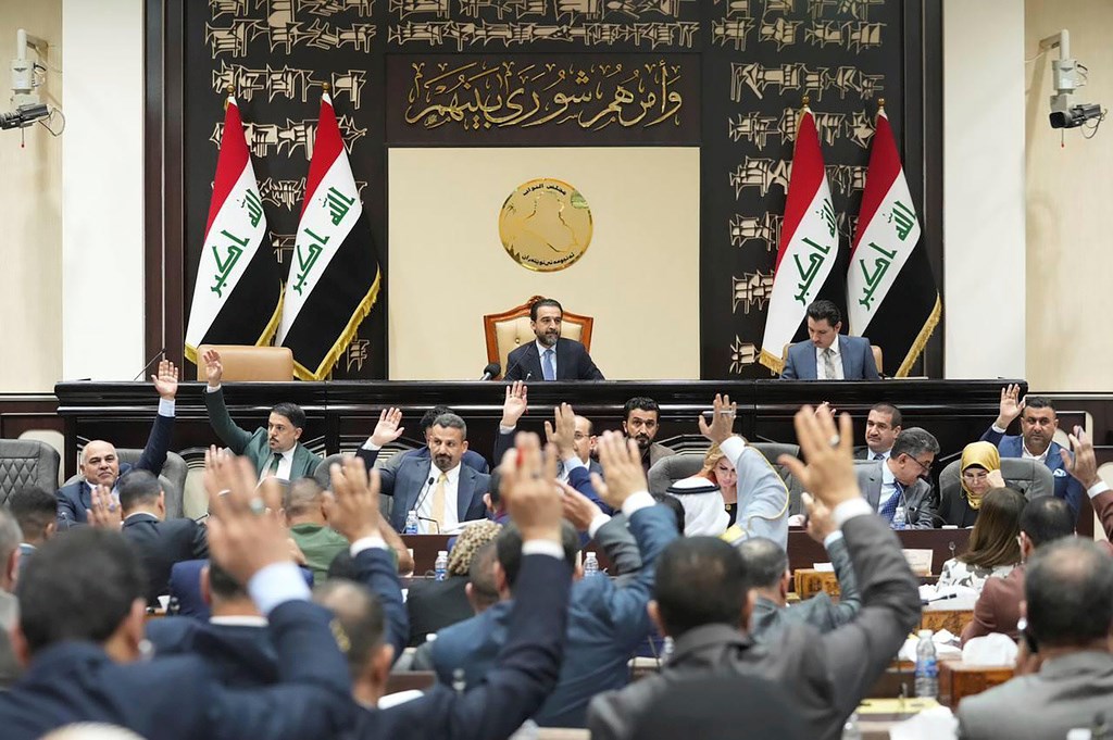 This photo from Iraqi parliament shows the Iraqi lawmakers attend a parliamentary session to vote on the federal budget at the parliament headquarters in Baghdad, Iraq, Sunday, June 11, 2023. (AP)