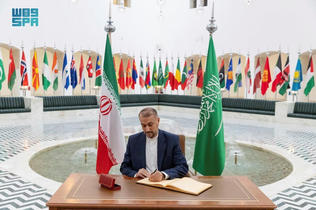 In this handout image released by the state-run Saudi Press Agency, Iranian Foreign Minister Hossein Amirabdollahian signs a register at the Saudi Foreign Ministry in Riyadh, Saudi Arabia, Thursday, Aug. 17, 2023. (AP)