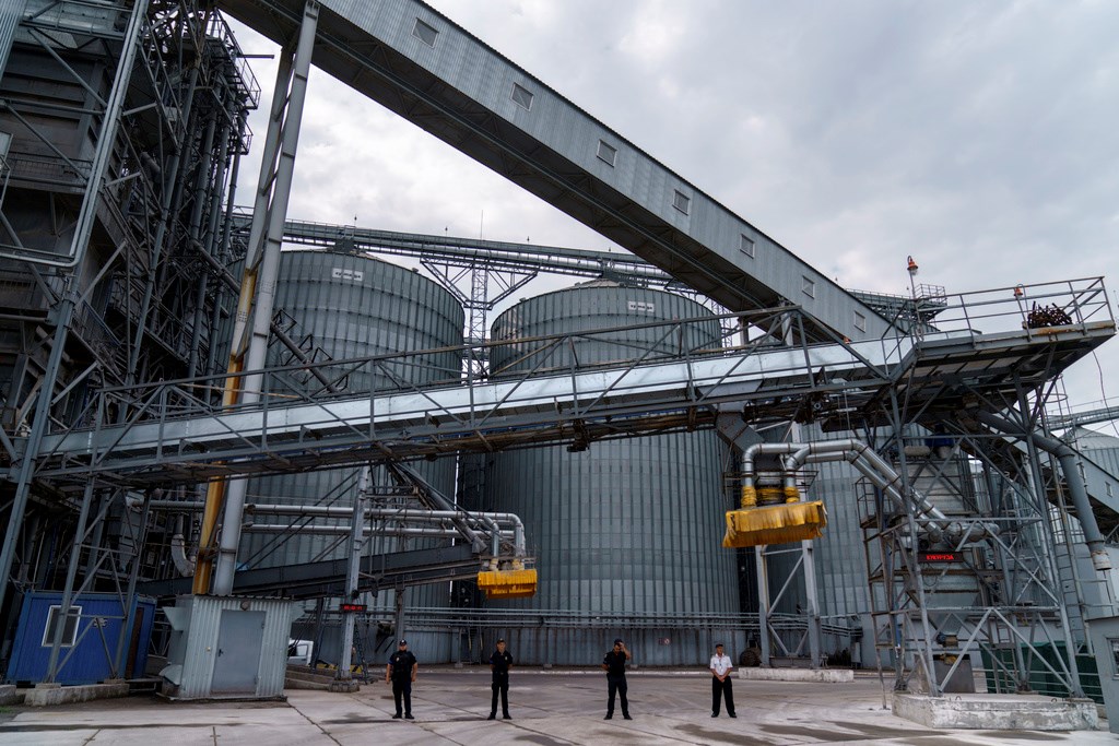 Security personnel stand in front of a grain storage terminal at the Odessa Sea Port, in Odessa, Ukraine, on July 29, 2022 (AP Photo/David Goldman, File)