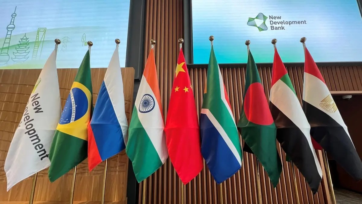 Flags are seen displayed at the opening ceremony of the New Development Bank Eighth Annual Meeting in Shanghai on May 30, 2023. (AFP)