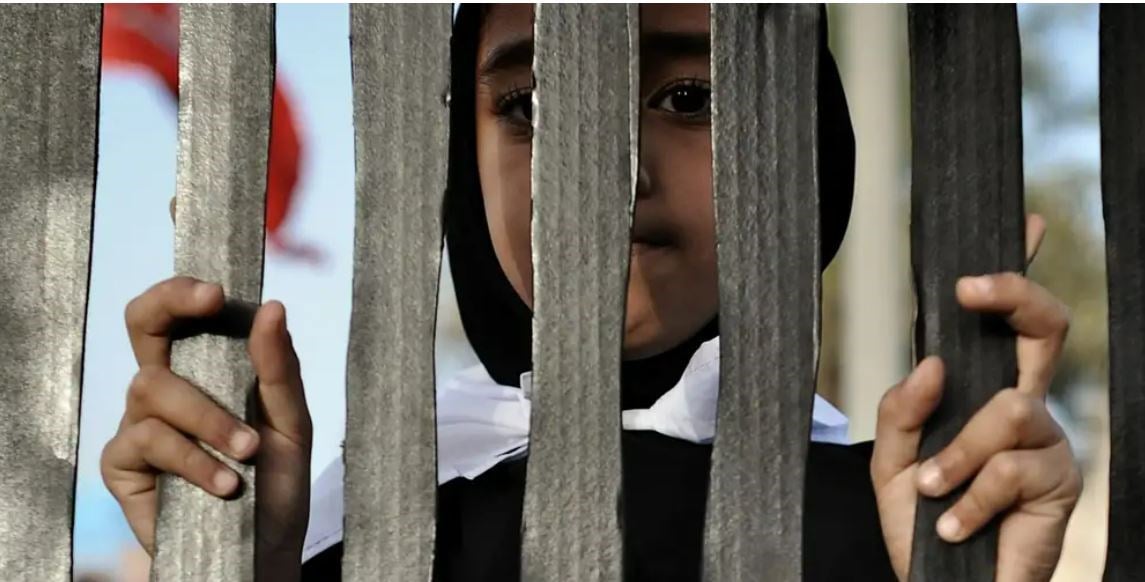 A Bahraini woman during an anti-government rally in solidarity with jailed political prisoners in the village of A’ali, 27 June 2013. (AFP via Getty Images)