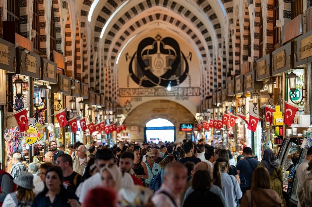 Customers walk in The Spice Bazaar, Eminonu District in İstanbul on Sept. 6, 2022. (AFP)