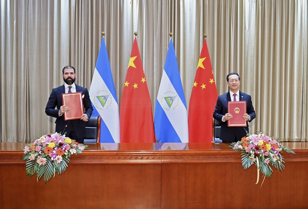 Laureano Ortega Murillo, son of and advisor to Nicaraguan President Daniel Ortega, left, and Chinese Vice Foreign Minister Ma Zhaoxu in 2021 (AP)