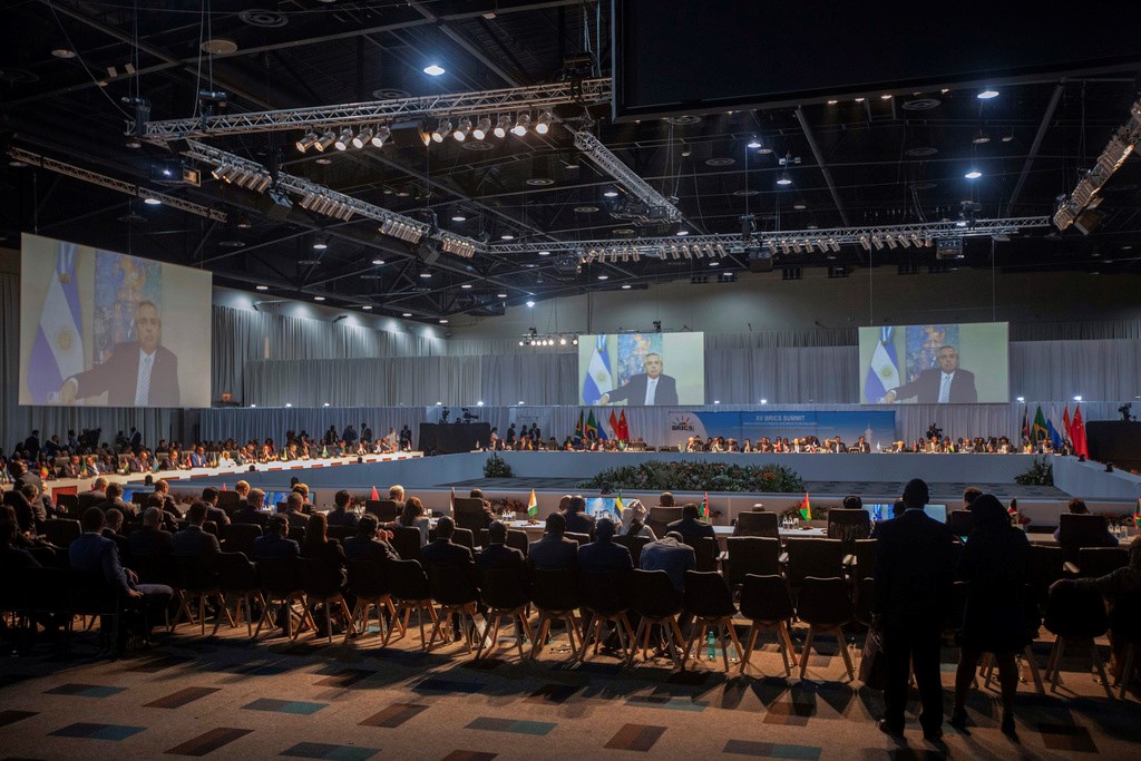 Argentine President Alberto Angel Fernandez appears on a screen as he addresses the 15th BRICS Summit, in Johannesburg, South Africa, Thursday, Aug. 24, 2023 (Kim Ludbrook/Pool via AP)