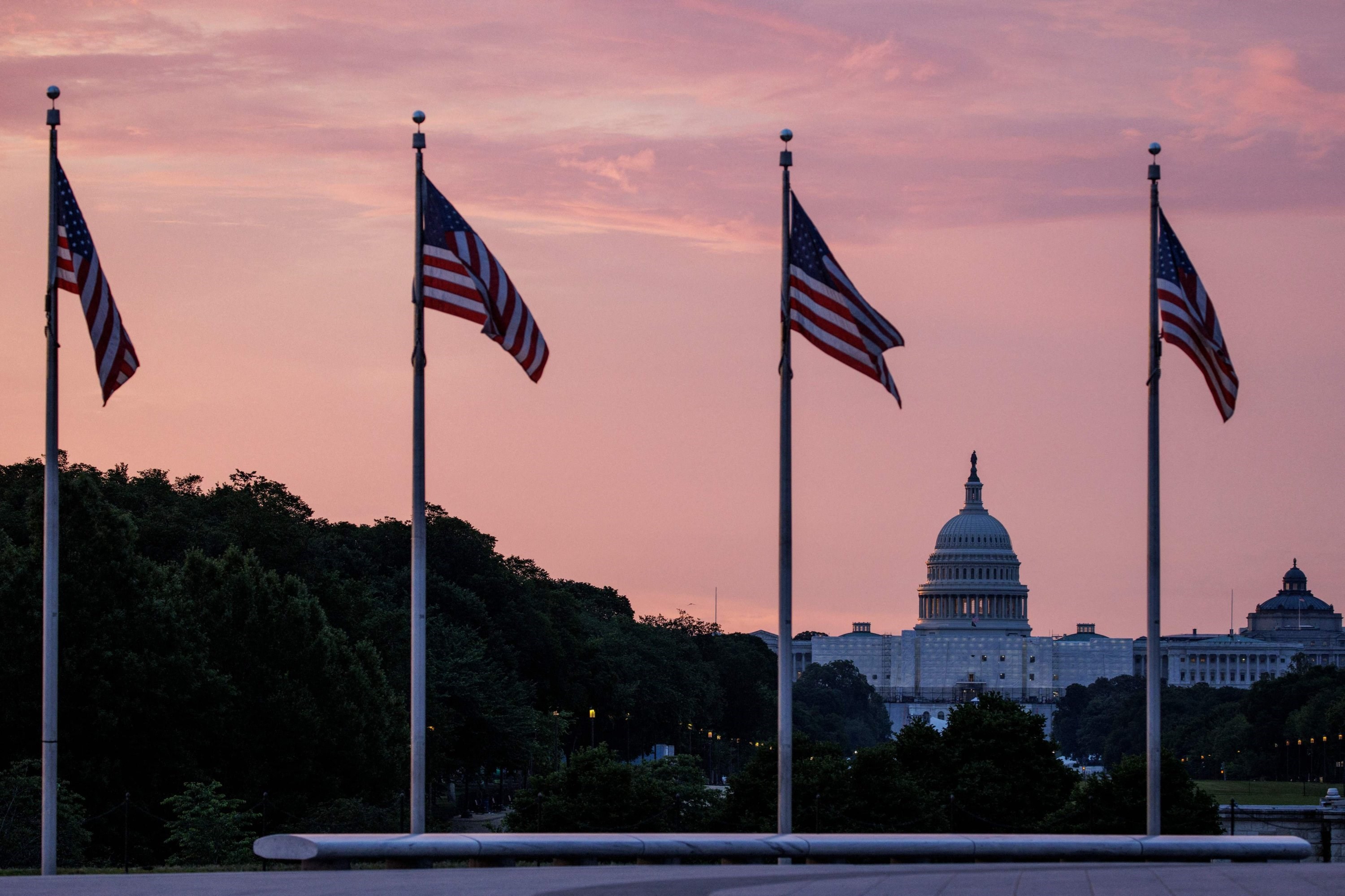 The U.S. Capitol building is seen from the base of the Washington Monument as the sun rises in Washington, D.C., U.S., May 28, 2023. (AFP)