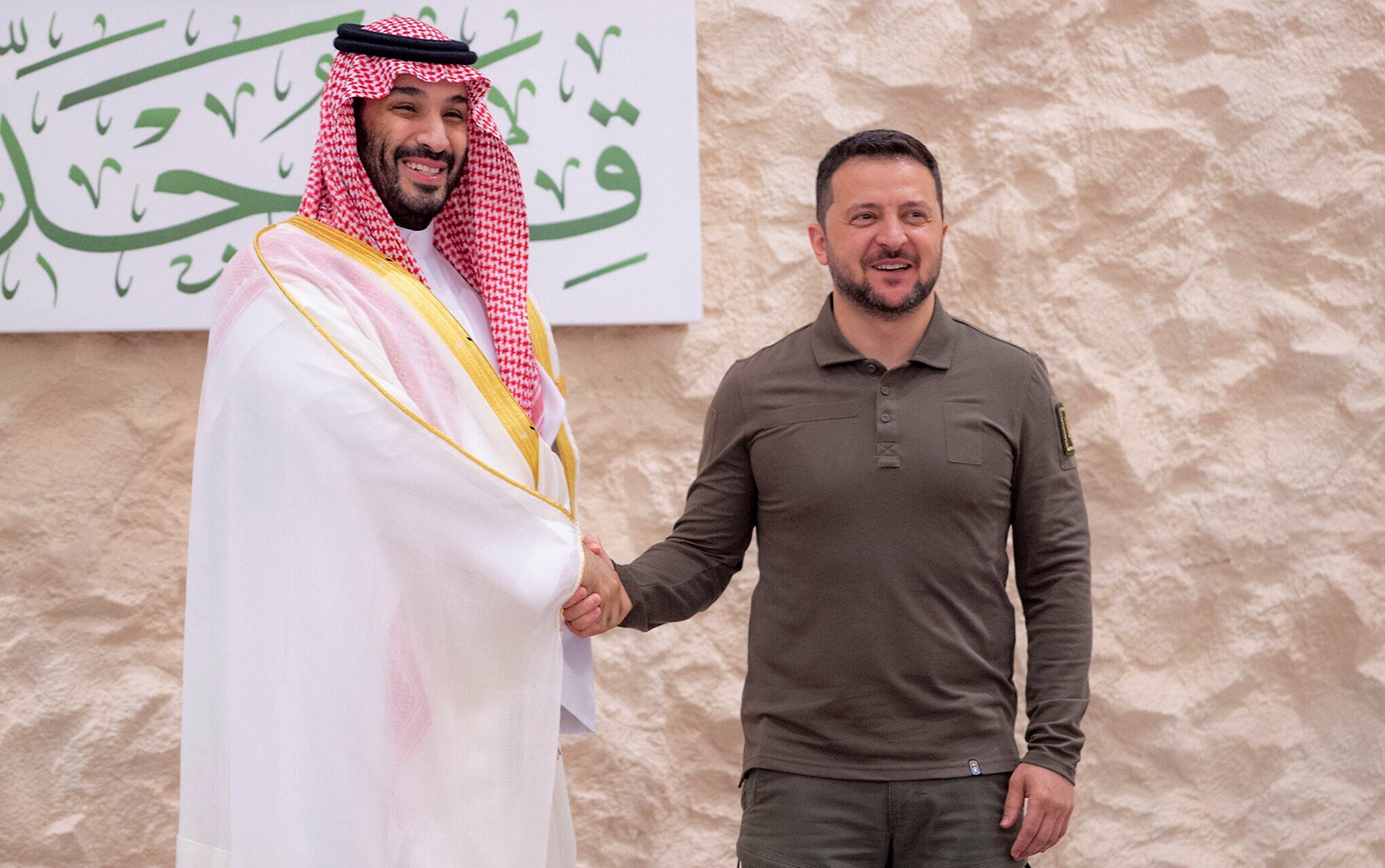 Saudi Crown Prince Mohammed bin Salman greets Ukraine's President Volodymyr Zelensky, right, during the Arab summit in Jeddah, Saudi Arabia, on May 19, 2023. (Saudi Press Agency/AP)