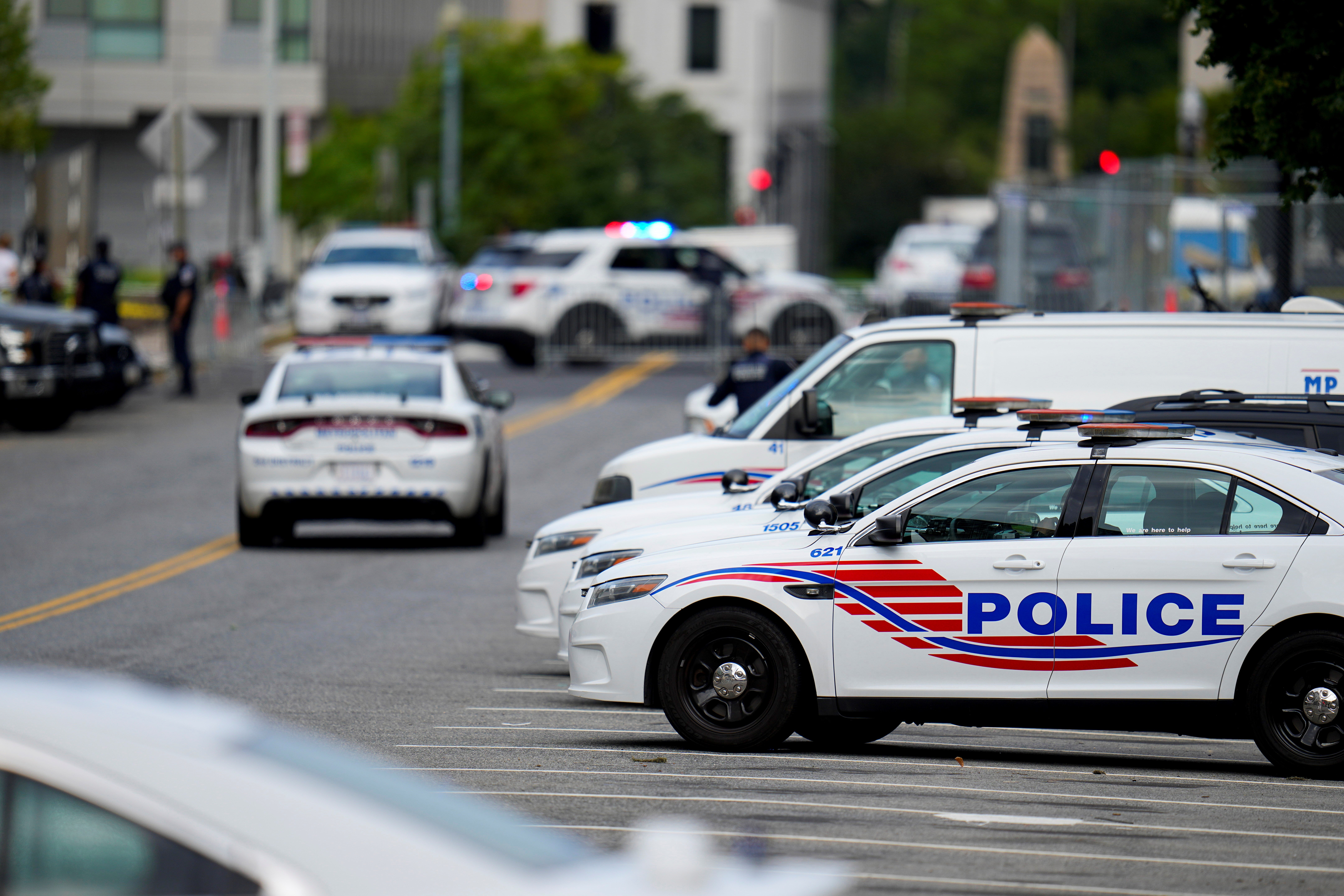 Washington Metropolitan Police patrol the area outside the E. Barrett Prettyman US Federal Courthouse, Aug. 3, 2023, in Washington (AP)