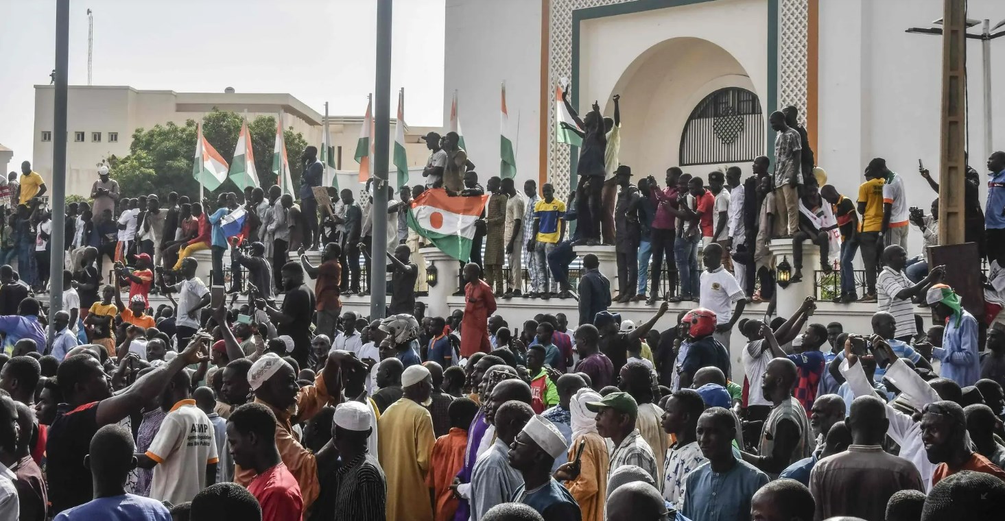 Protesters gather outside the National Assembly in Niamey, Niger. (AFP)