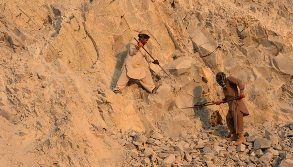 Afghan laborers work at a stone mine on the outskirts of Jalalabad, Afghanistan, on Dec. 27, 2016. (AFP via Getty Images)