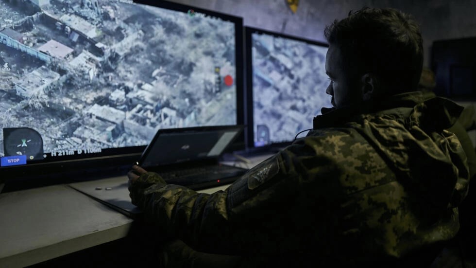 In this photo from December 25, 2022, a Ukrainian soldier watches a drone feed from an underground command centre in Bakhmut, in the Donetsk region (AP)