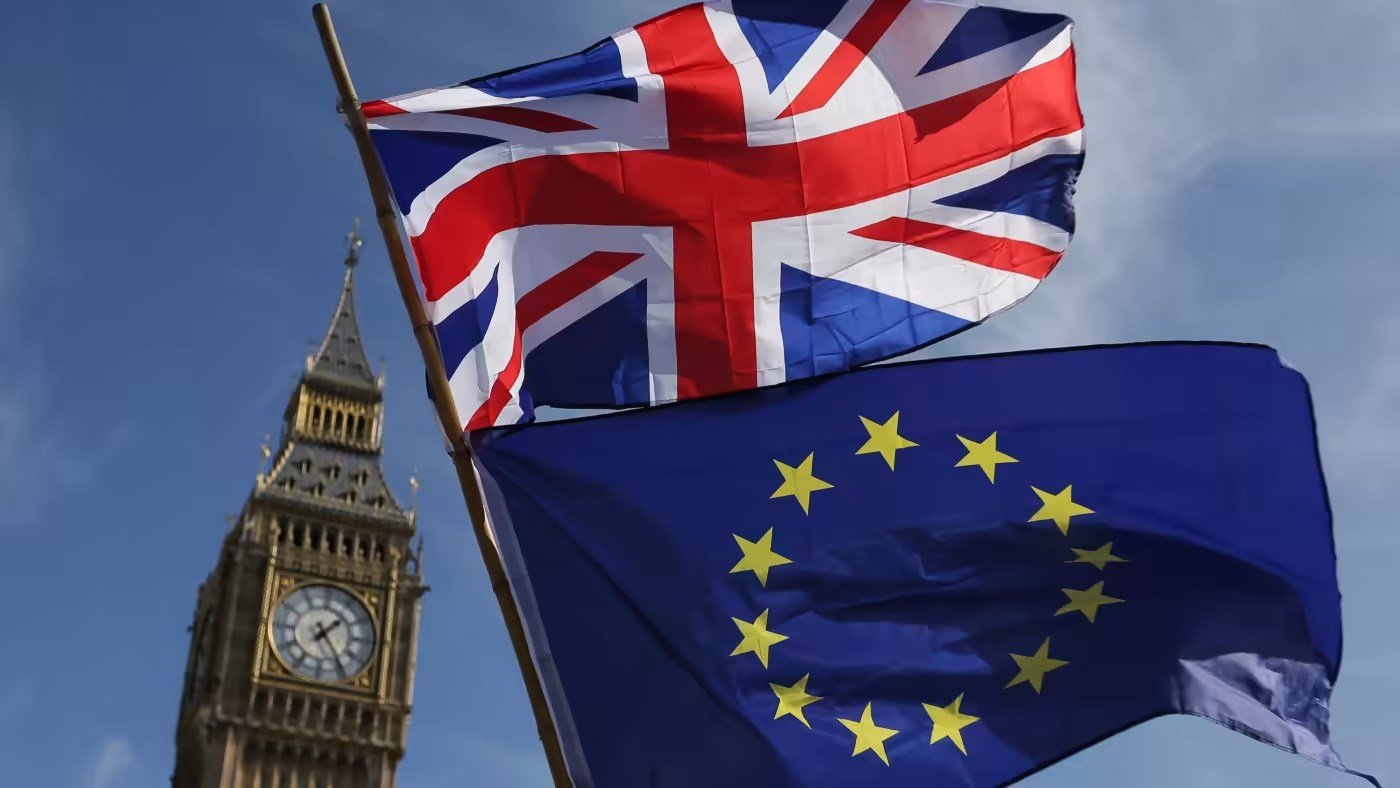 File photo of an EU flag and a Union flag seen with Elizabeth Tower (Big Ben) and the Houses of Parliament in London taken on March 25, 2017 (AFP)