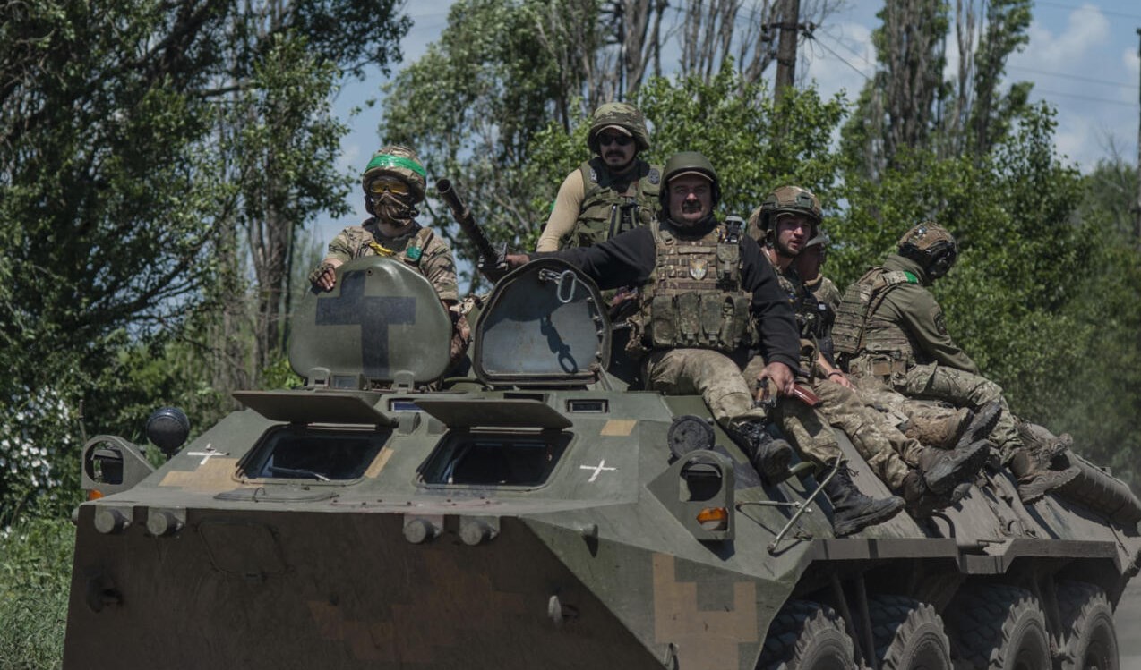Ukrainian soldiers ride an APC on the front line near Bakhmut, in the Donetsk region, on June 5, 2023 (AP)