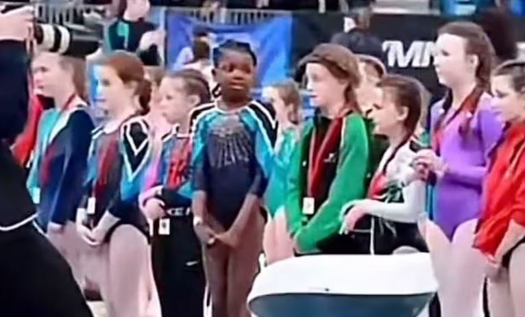 During the March 2022 ceremony, a participation medal was denied to the sole black girl in the lineup. (Twitter)
