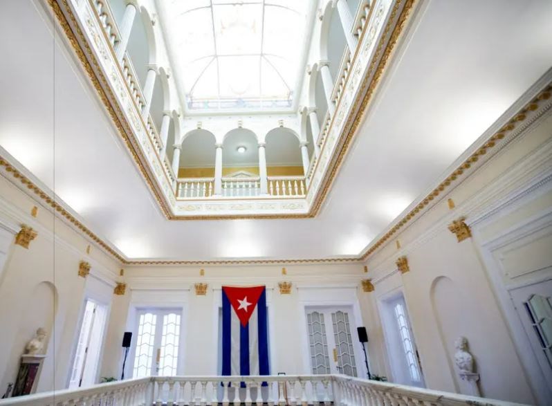 Cuban flag flutters inside the Cuban embassy in Washington (AP)