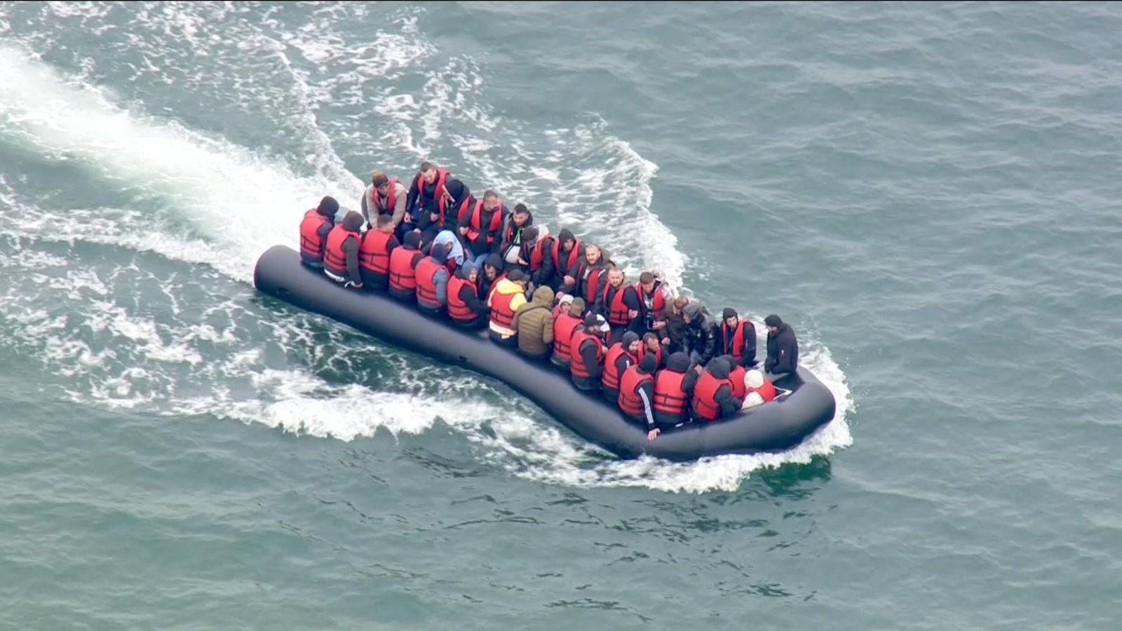 A group of migrants in a dinghy approach southern England after crossing the Channel from France on September 1, 2020. (AFP)