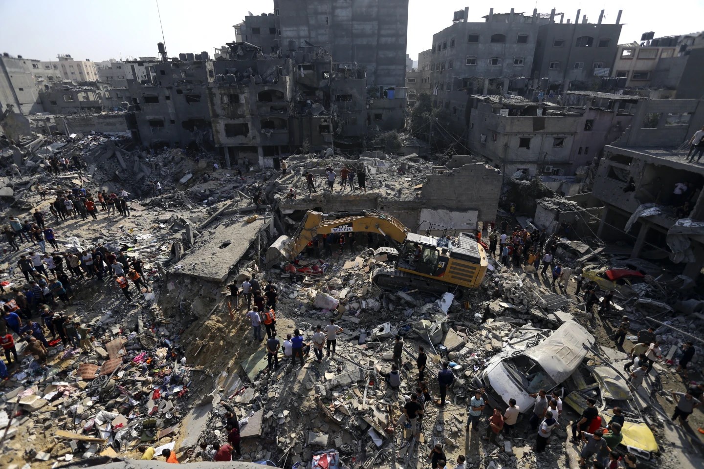 Palestinians look for survivors under the rubble of destroyed residential building following Israeli airstrikes in Jabaliya refugee camp, November 1, 2023. (AP)