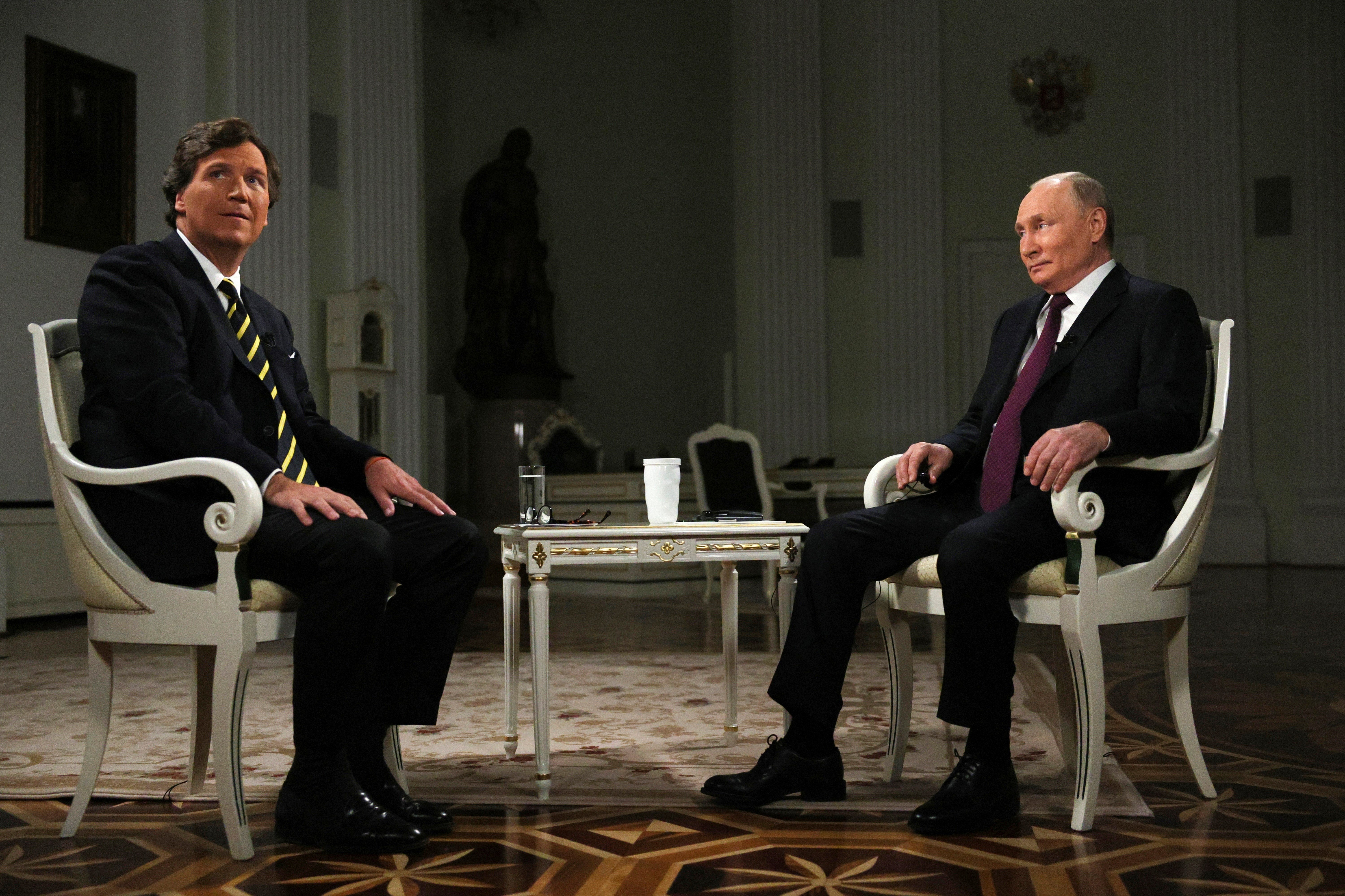 Released by Sputnik on Feb. 9, 2024, Russian President Vladimir Putin and former Fox News host Tucker Carlson prepare to an interview at the Kremlin in Moscow, Russia, Tuesday, Feb. 6, 2024. (AP)