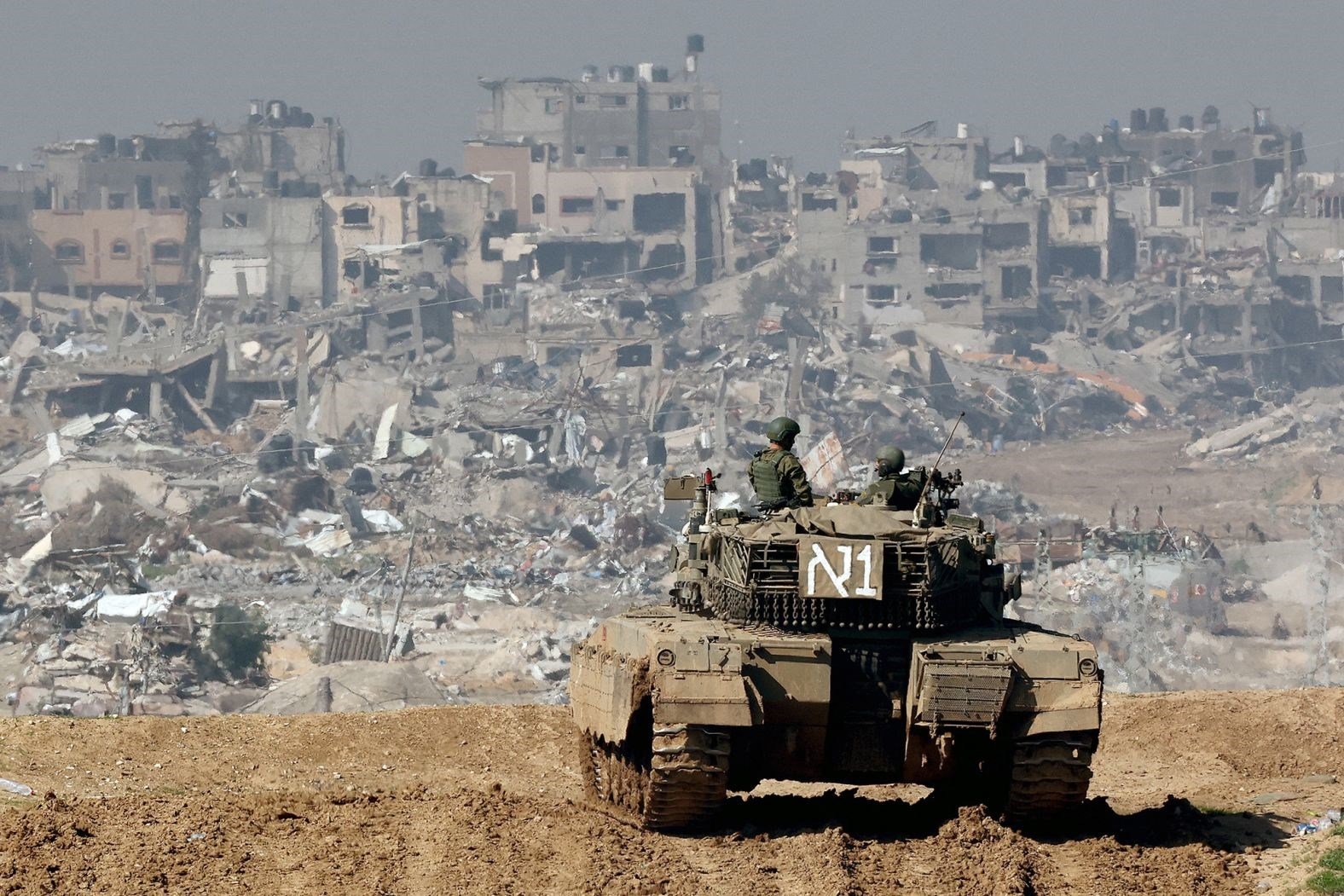 An Israeli tank patrols destroyed areas in Gaza on January 19. (AFP/Getty Images)