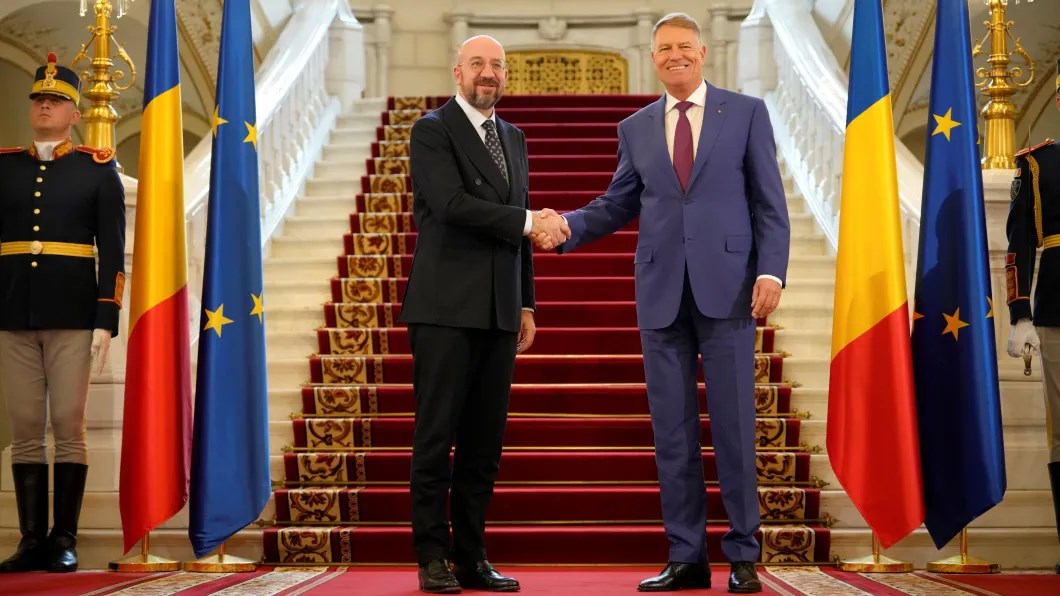 European Council President Charles Michel shakes hands with Romanian President Klaus Iohannis at the Cotroceni Presidential Palace in Bucharest, Romania, March 27, 2023 (AP).